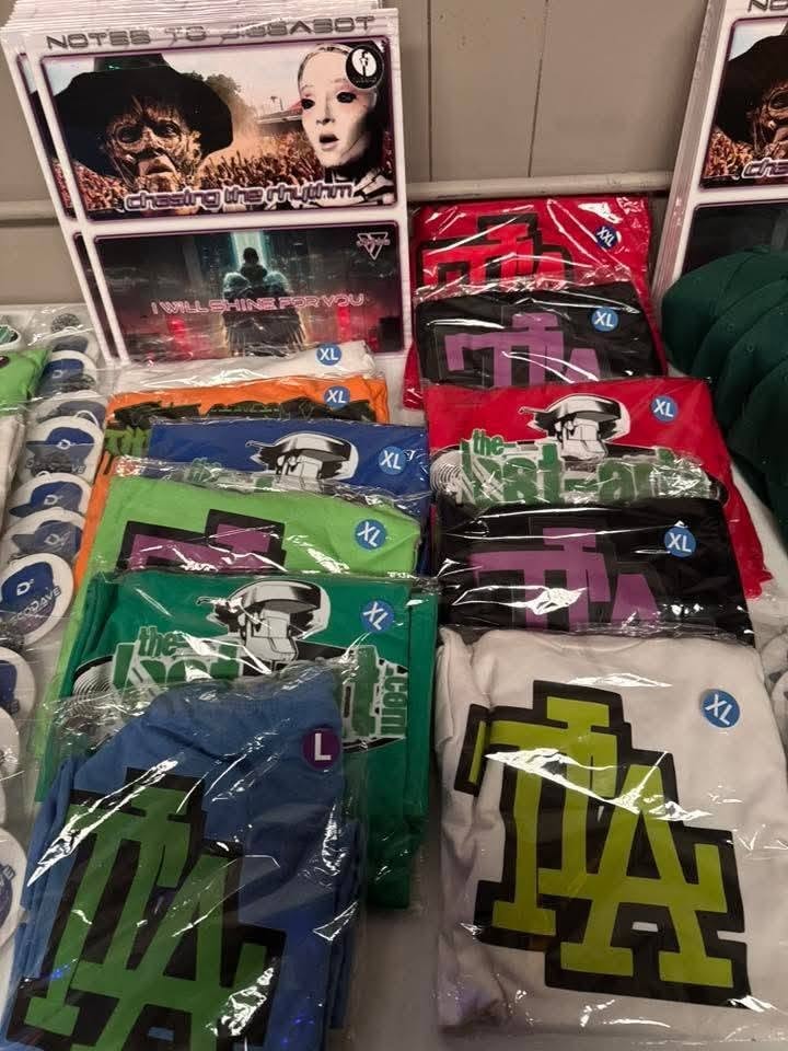 Merch table at the Florida underground show May 2026, Notes to Jiggabot CDs and The-Lost-Art.com merchandise