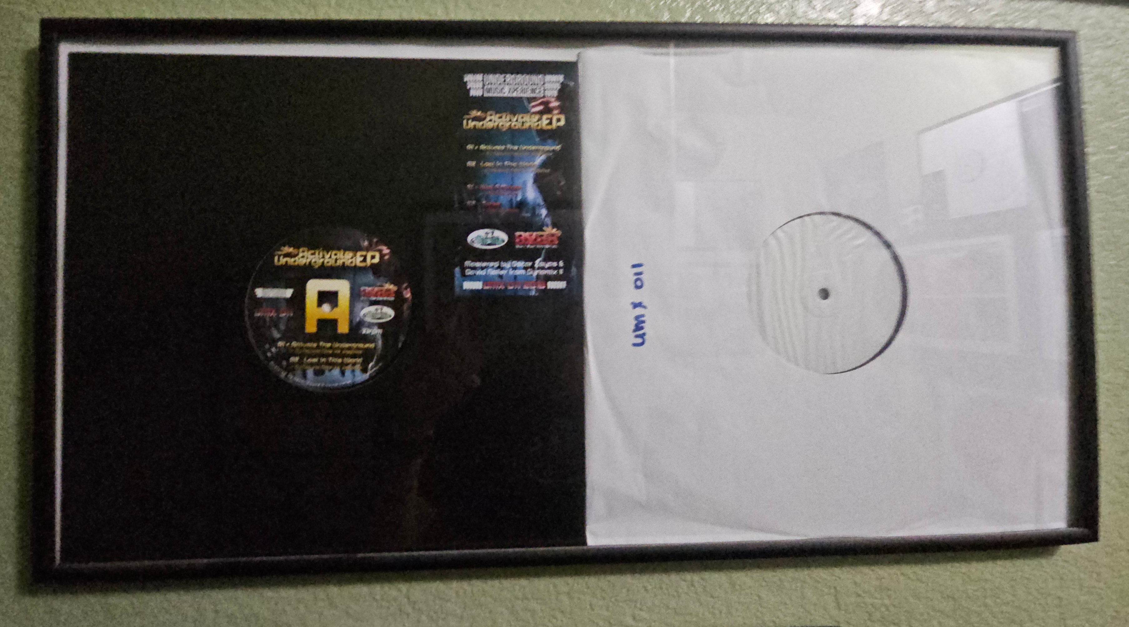 Activate Underground EP, UMX 011, framed original vinyl A-side label with handwritten catalog number on white label test pressing, DJ Natural Nate Wall of Fame