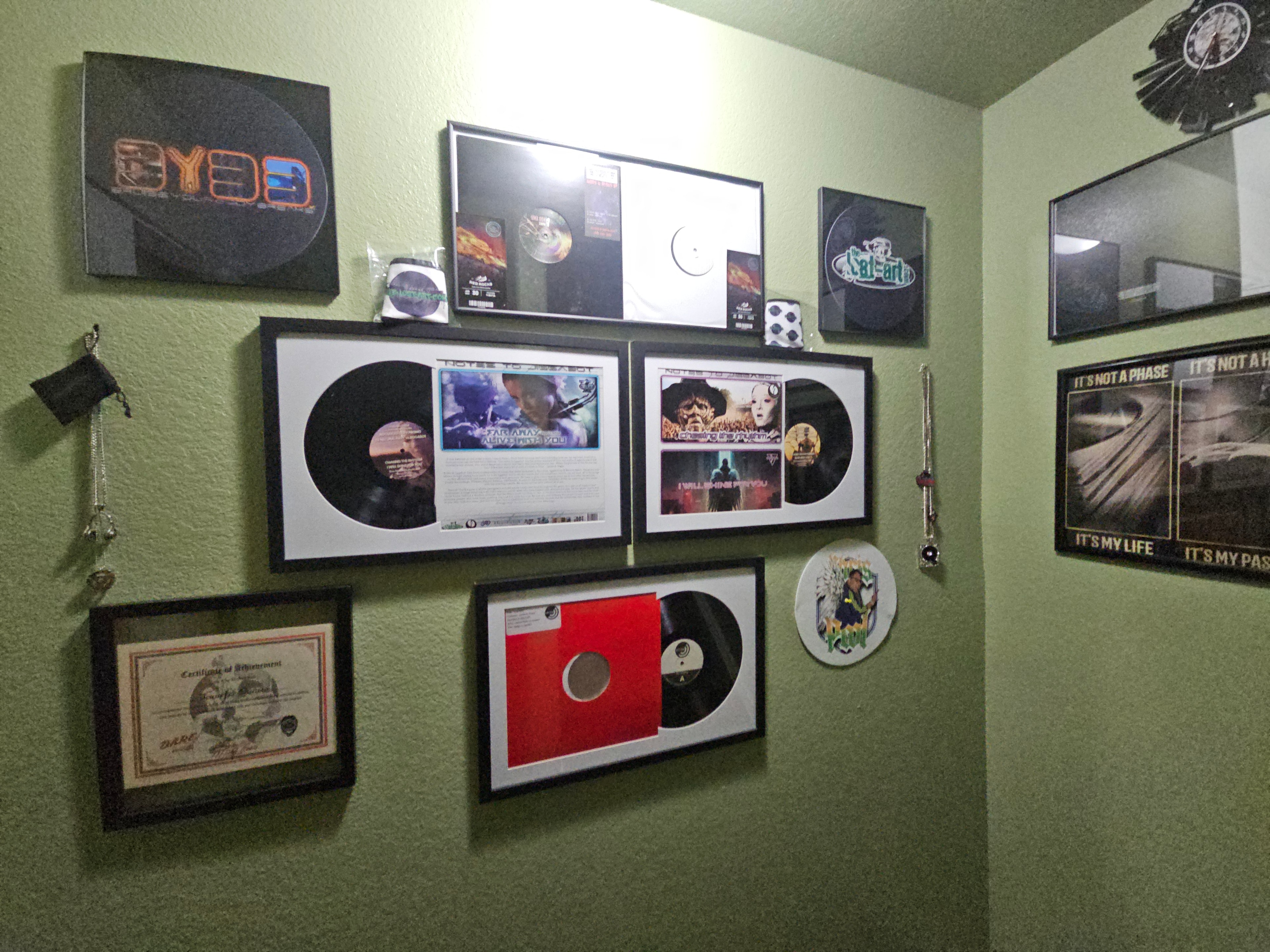 DJ Natural Nate® Wall of Fame, framed vinyl releases, world record certificate, trademark certificate, and RecordSetter gold shirt: the complete physical legacy display
